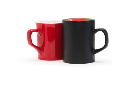Stylish modern red and black mugs on white background. Clipping path is includedの写真素材