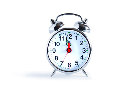 Ordinary metal alarm clock on white background. Clipping path is included