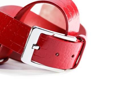 New stylish red leather belt on white の写真素材