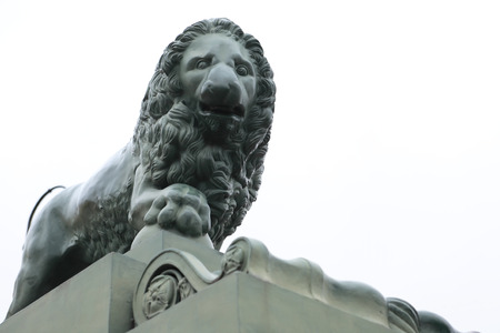 Marble lion sculpture closeup on white の写真素材