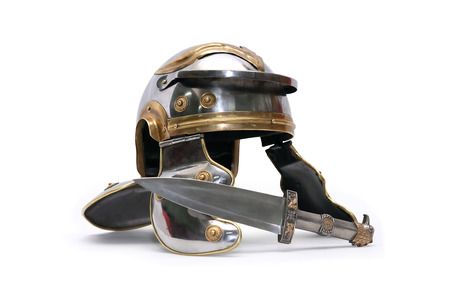 Ancient Roman military helmet near dagger on white background. Clipping path is includedの写真素材