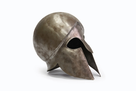 Ancient Greek military helmet on white の写真素材