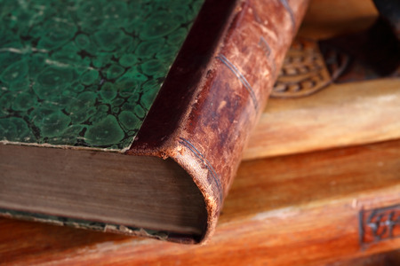 Closeup of old book on wooden background