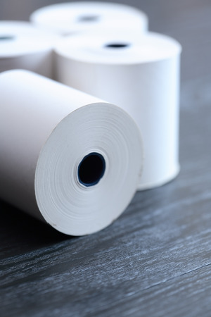 Set of white paper rolls on dark backgroundの写真素材