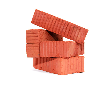 Stack of few red bricks on white background
