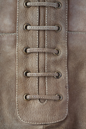 Closeup of gray suede background with lacingの写真素材