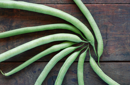 Background made from lot of freshness green beanstalk on wooden boardの写真素材