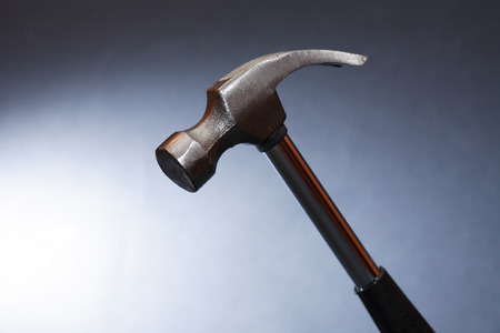 Work tool. Metal hammer closeup on nice dark background