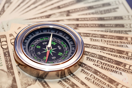 Closeup of compass on USA dollar bank notes