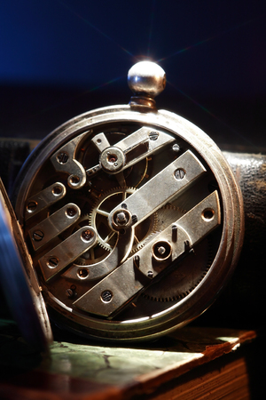 Vintage still life. Closeup of old pocket watch mechanismの写真素材