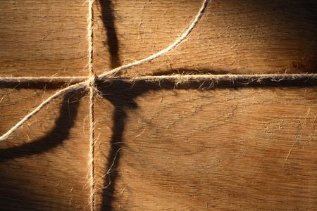 Nice oak timber tied with rope. Wooden backgroundの写真素材