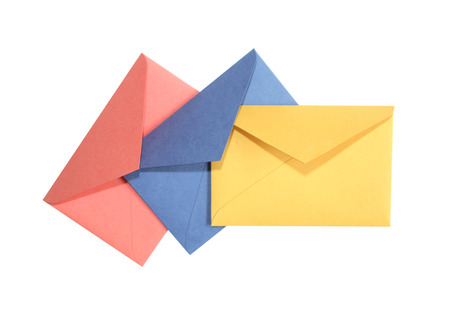 Three colored open envelopes on white background.の写真素材