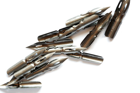 Vintage steel nib set at line on white backgroundの写真素材