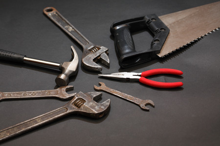 Set of old tools on dark background with free space for text
