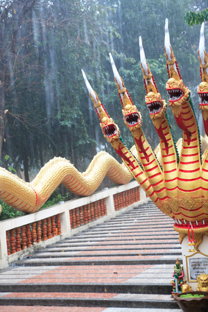 Detail of a Buddhist temple in Pattaya under rain, Thailandの写真素材
