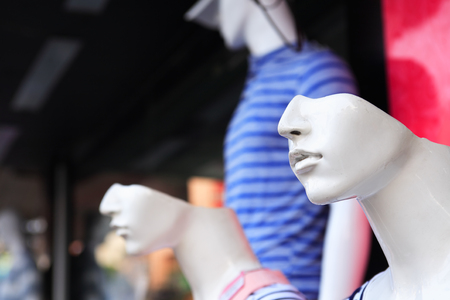 Closeup of model mannequins near shop window outdoorの写真素材