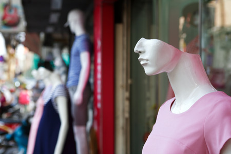 Closeup of model mannequins near shop window outdoorの写真素材