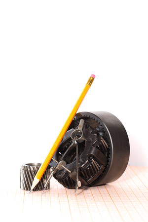 Engineering concept. Set of various gears on graph paperの写真素材