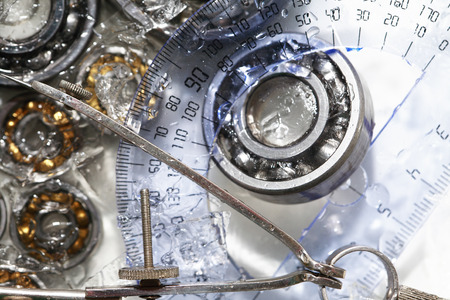 Machinery concept. Closeup set of ball bearings under frozen waterの写真素材