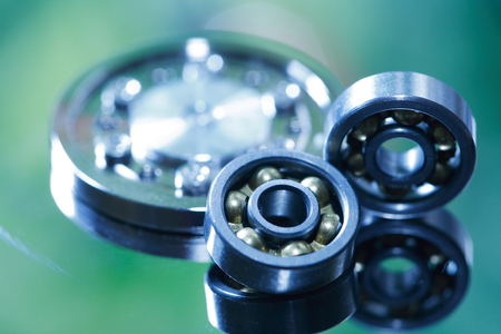Machinery concept. Closeup set of ball bearings on nice gradient backgroundの写真素材