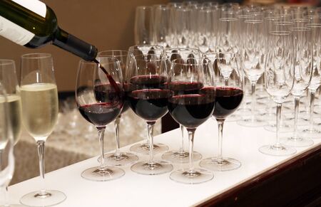 Cocktail party. Bar counter with red wine for companyの写真素材