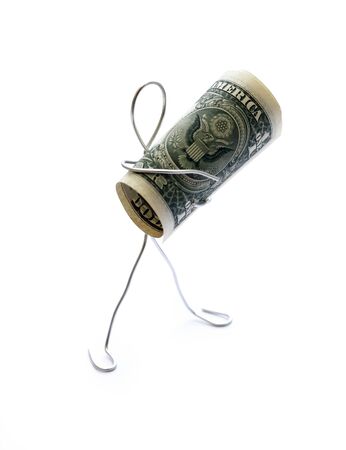 Man made from aluminum wire holding one dollar bank noteの写真素材