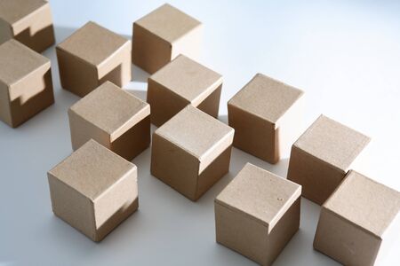 Set of cardboard cubes on white background with light and shadowsの写真素材