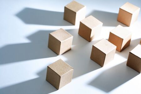 Set of cardboard cubes on white background with light and shadowsの写真素材