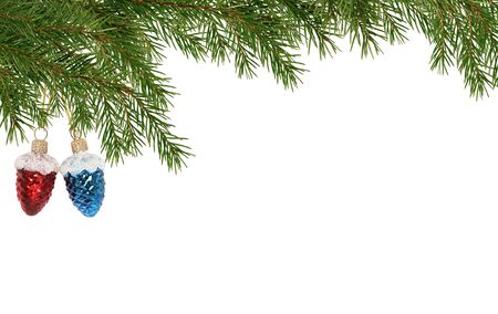 Christmas decoration. Fir twigs as border with Christmas balls on white backgroundの写真素材