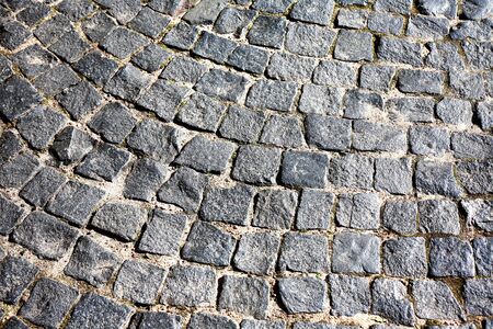 Old Pavement Background. Old empty cobblestone roadway in provincial townの写真素材