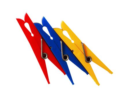 Three various plastic clothespins on white backgroundの写真素材