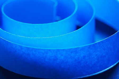 Blue spiral made from paper extreme closeup. Conceptual backgroundの写真素材