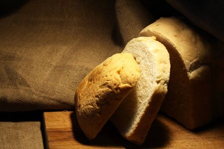 Sliced loaf of white bread on canvas backgroundの写真素材