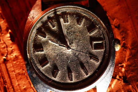 time concept. Extreme closeup of very old wristwatch with dustの写真素材
