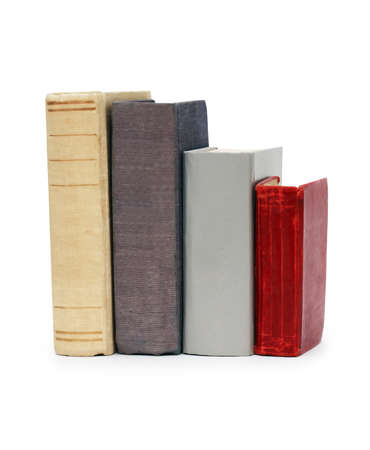 Few old books in a row isolated on white background with clipping pathの写真素材