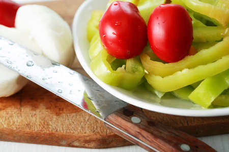 Closeup of various chopped vegetables on cutting boardの写真素材