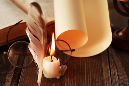 art concept. One lighting candle near and old thingsの写真素材