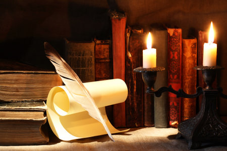 Nice vintage candlestick on background with old booksの写真素材