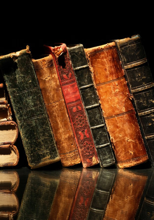Set of various old books on black backgroundの写真素材