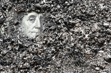 Ashes Of Former Hopes. A hundred dollar bill with Franklin's face under a layer of ashesの写真素材