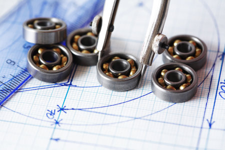 Engineering concept. Set of ball bearings and drawing toolsの写真素材