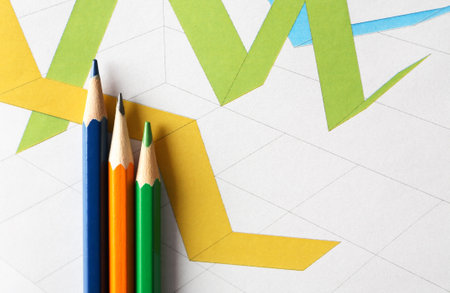 Business concept. Colored pencils on the background of the diagram