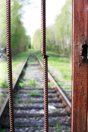 An abandoned old railway in the middle of the forestの写真素材