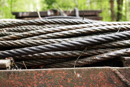 Industrial background. Extreme closeup of old metal hawser