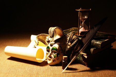 Vintage still life with various ancient things and venetian mask on dark backgroundの写真素材