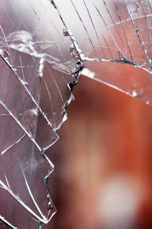 Closeup of shattered windowの写真素材