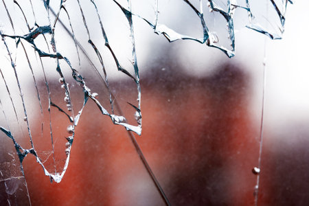 Closeup of shattered windowの写真素材