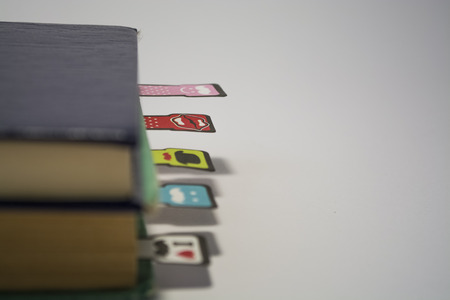 Pile of old books with the turned yellow sheets on a white background.の写真素材