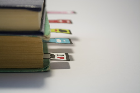 Pile of old books with the turned yellow sheets on a white background.の写真素材