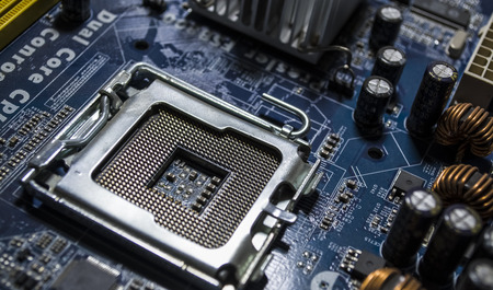 Texture. Background. Modern computer technologies. The old multi-colored motherboard with dust....